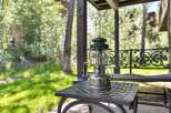 Enjoy the serene outdoor living spaces of this property, featuring a charming covered patio perfect for relaxation.