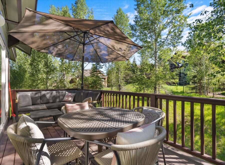 Enjoy outdoor living on this spacious deck, perfect for entertaining or relaxing.