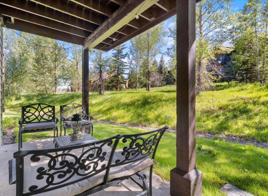 Enjoy the serene mountain views from this charming covered patio, perfect for relaxing or entertaining.