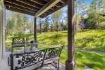 Enjoy the serene mountain views from this charming covered patio, perfect for relaxing or entertaining.