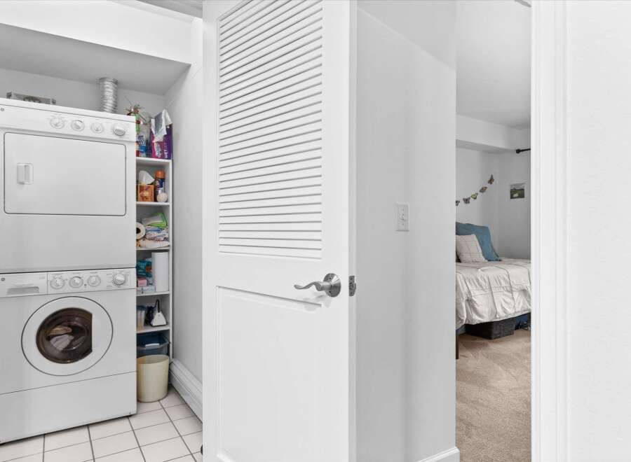 Discover convenient in-unit laundry facilities with a stacked washer and dryer, perfect for modern living.