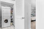 Discover convenient in-unit laundry facilities with a stacked washer and dryer, perfect for modern living.