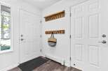 Welcome guests into this charming entryway featuring a stained-glass window with delicate hummingbird designs.