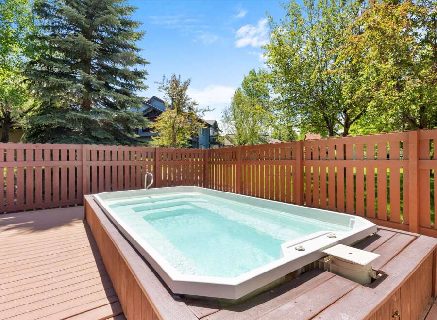 Enjoy ultimate relaxation in this stunning backyard oasis, featuring a spacious hot tub perfect for unwinding after a long day.