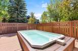 Enjoy ultimate relaxation in this stunning backyard oasis, featuring a spacious hot tub perfect for unwinding after a long day.
