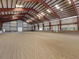 This spacious indoor arena offers a versatile space for equestrian activities.