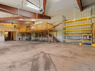 This spacious property offers a versatile layout, perfect for a workshop or storage.