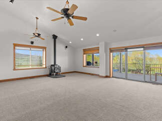 This spacious living area features a cozy fireplace, perfect for chilly evenings.