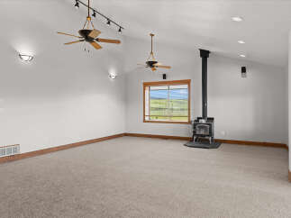 This spacious living area features a cozy fireplace, perfect for chilly evenings.