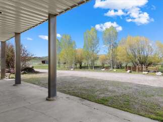 Enjoy the serene beauty of this property, featuring a spacious outdoor area perfect for relaxation and entertaining.