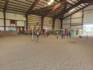 This equestrian facility offers a spacious indoor arena, perfect for year-round riding and training.