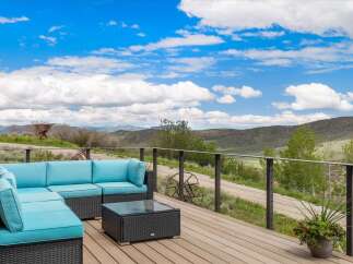 Enjoy breathtaking mountain views from this stunning outdoor living space.