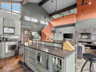 This stunning kitchen boasts a modern design with a touch of rustic charm.