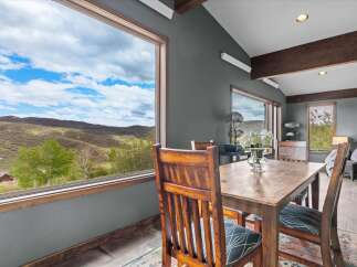 Experience breathtaking views from this stunning dining room.