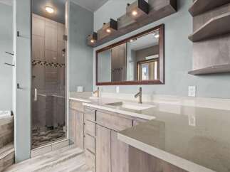 Step into luxury with this stunning bathroom featuring a modern design and high-end finishes.