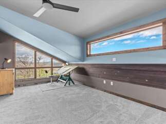 This stunning room features a unique design with a combination of natural light and modern elements.