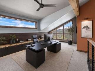 Step into luxury with this stunning home office, featuring a sleek black desk and ample storage.