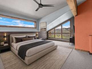 Experience luxury in this stunning bedroom featuring a modern design and breathtaking views.