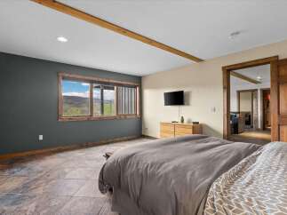 Discover the charm of this inviting bedroom, featuring a serene ambiance and stylish design.