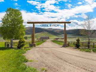 Welcome to Creek Ranch, a stunning property offering a serene escape.