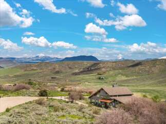 Nestled amidst the breathtaking landscapes, this stunning property offers a serene escape.