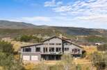 Discover this stunning modern home nestled in a picturesque landscape, offering breathtaking mountain views.