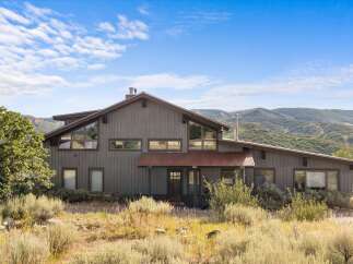 Experience rustic charm and breathtaking mountain views from this unique home.