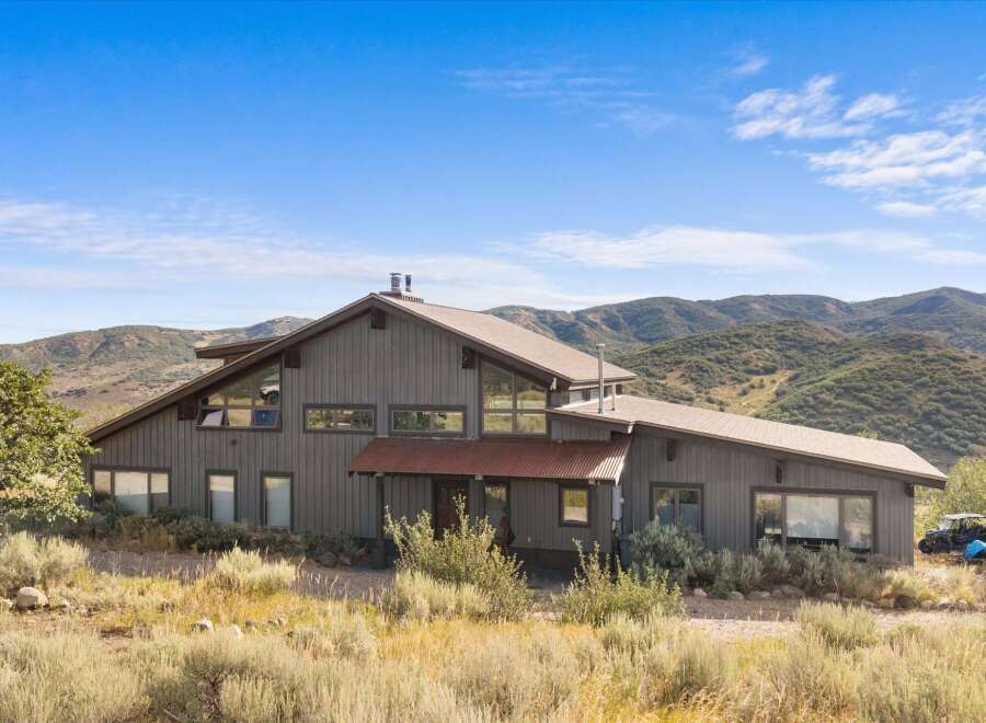 Nestled amidst rolling hills, this stunning property offers a unique architectural design with expansive windows that capture breathtaking natural light and scenic views.