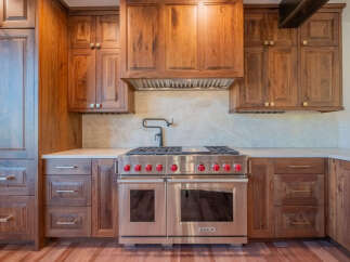 This stunning kitchen boasts custom cabinetry and high-end appliances, perfect for the discerning homeowner.