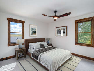 This stunning bedroom features a cozy and inviting atmosphere, perfect for relaxation.