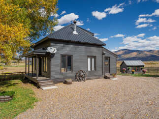 Nestled in a picturesque landscape, this charming property boasts a unique blend of rustic charm and modern comfort.
