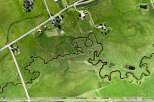 Discover this stunning aerial view of a sprawling green landscape, perfect for agricultural or recreational use.