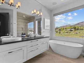 Indulge in luxury with this stunning bathroom featuring a sleek, modern design.