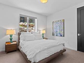 This stunning bedroom boasts a serene ambiance, perfect for relaxation.
