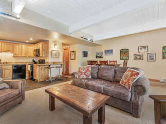 This cozy living space features a comfortable leather sofa, perfect for relaxing after a long day.
