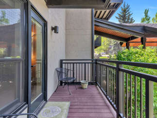 Enjoy the fresh air and stunning views from this charming balcony.