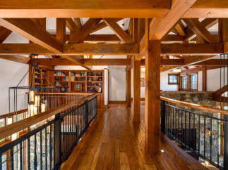 Step into luxury with this stunning property featuring exquisite wooden beams and a captivating library.