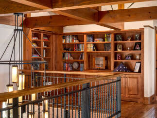 This stunning property boasts a custom-built wooden bookcase, perfect for showcasing your literary collection or cherished decor.