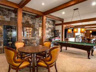 Step into luxury with this stunning property featuring a game room designed for ultimate entertainment.