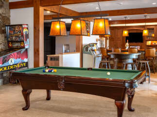 This luxurious property boasts a stunning game room, perfect for entertaining guests.