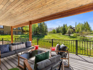Enjoy breathtaking mountain views from this stunning outdoor living space.