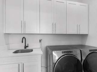 This stunning laundry room boasts modern design and functionality.