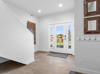 Step into this inviting entryway, showcasing a bright and airy atmosphere.