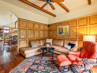 This stunning living space boasts a cozy sectional sofa, perfect for relaxing.