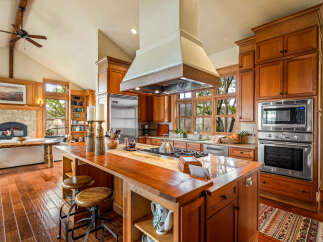 This stunning kitchen boasts custom cabinetry, stainless steel appliances, and a spacious island perfect for entertaining.