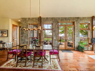 This stunning dining room showcases a perfect blend of rustic charm and modern elegance.