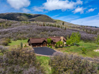 Nestled amidst the serene beauty of the mountains, this stunning property offers a luxurious retreat.