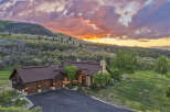 Experience luxury mountain living in this stunning estate, nestled amidst breathtaking natural beauty.