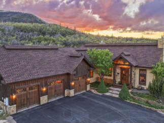 Experience luxury mountain living in this stunning custom-built home, nestled against a backdrop of breathtaking natural beauty.