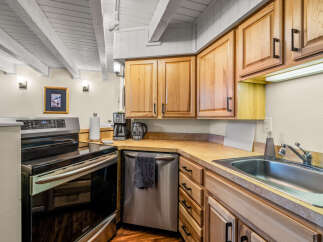 This charming kitchen boasts a warm and inviting atmosphere, perfect for culinary adventures.